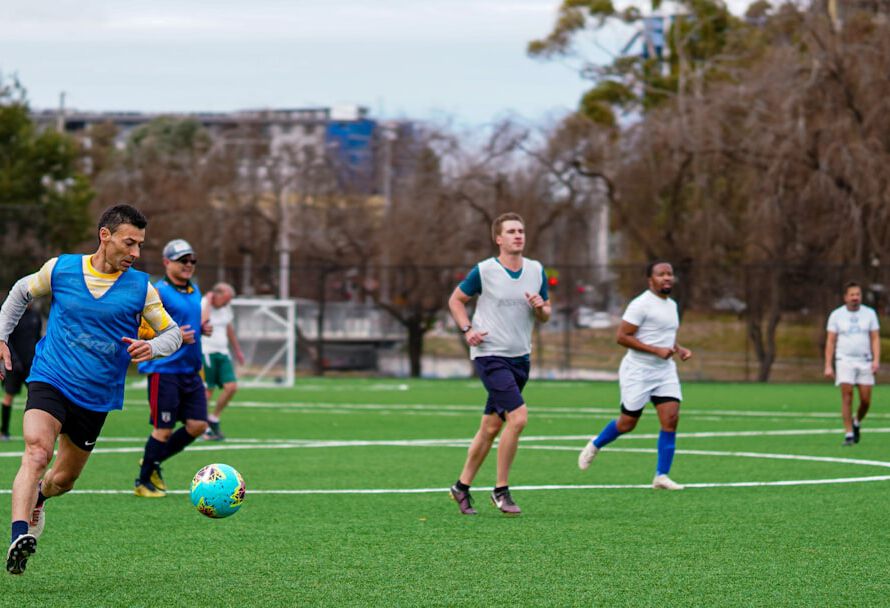 A group of men playing a game of soccer